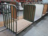 a metal cart with a mattress on it in a warehouse