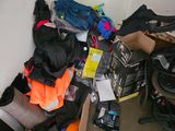 a pile of clothes and other items on the floor