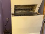 a machine that is sitting in the corner of a room