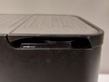 a black printer sitting on top of a white table