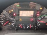 a close up of a car dashboard with various gauges and numbers