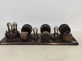 a wooden stand with three different types of electrical equipment on it