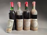 trois bouteilles de vin sont posées l'une à côté de l'autre sur une table