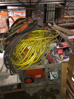 a pile of yellow and black hoses in a room
