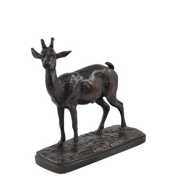 bronze statue of a deer on a base on a white background