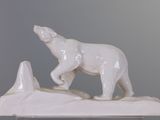 a statue of a polar bear standing on a rock