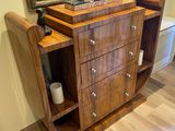 a wooden cabinet with a clock on top of it