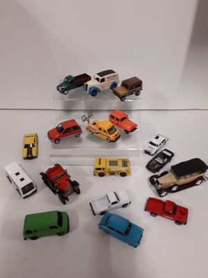 a lot of small toy cars on a white surface