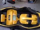 a yellow and black bag with a yellow and black device in it