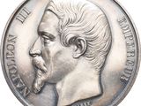 an old silver coin with a portrait of a man on it