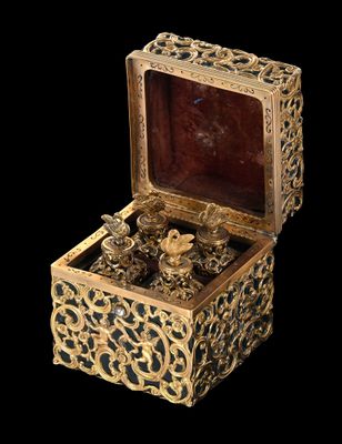 a gold box with a bunch of jewels inside of it