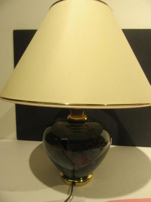a lamp that is sitting on a table in a room