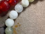 a bead of different colors and shapes on a table