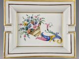 a close up of a plate with flowers and a bird on it