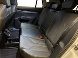 the back seats of a car with a seat belt in the back of it