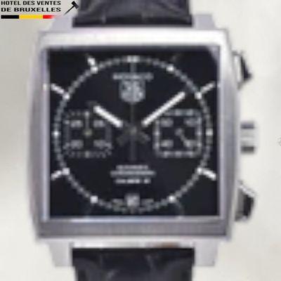 a close up of a watch with a black face