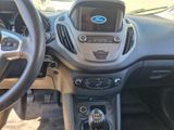 a dashboard of a car with a steering wheel and dashboard controls