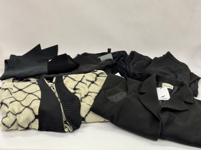 a pile of clothes sitting on top of a white table