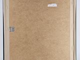 an easel with a piece of cardboard on top of it