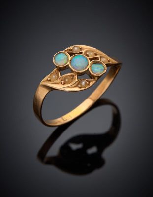 an image of a gold ring with oplites on it