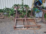 two pieces of wood sitting on the ground next to a building