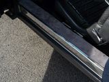 a close up of a car door with a glove in it