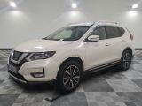 the white nissan suv is parked on a checkered floor