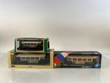 two boxed toy trains sitting on top of each other on a table