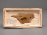 an image of a clay sculpture of a bird in a box