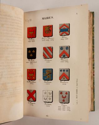 un livre ouvert sur lequel figurent plusieurs armoiries