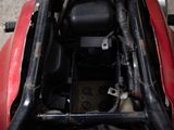 a close up of a red motorcycle with a black seat