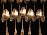 a lot of spoons that are sitting on a table