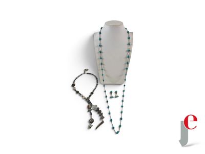 a necklace, bracelet, and earring on a white background
