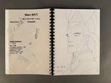 an open sketch book with a drawing of a man in a hat