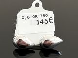 a tag with a price tag attached to it on a black surface