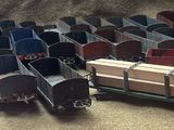a lot of toy trains that are sitting on the floor