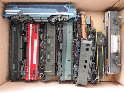 a box with a bunch of toy trains inside of it