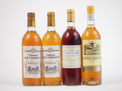 quatre bouteilles de vin sont alignées sur une surface blanche