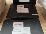 two laptops that are sitting on a table