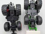 two toy trucks that are sitting side by side