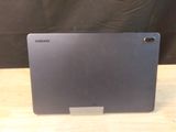 a laptop that is sitting on a wooden table