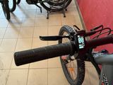 a close up of a bicycle with a number on the handlebar