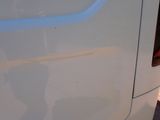 a close up of a car door with a person in it