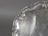 a silver plate that is sitting on a table