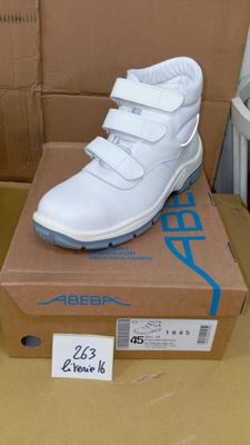 a box with a pair of white shoes on top of it