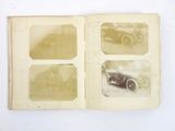 an old photo of an old car in a book