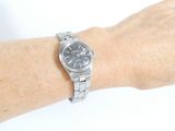 wrist shot of a person with a watch on their wrist