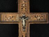 a cross with a crucif on it on a black background