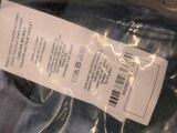a plastic bag with a label on it sitting on a table