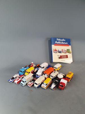 a lot of toy cars and a book on the table